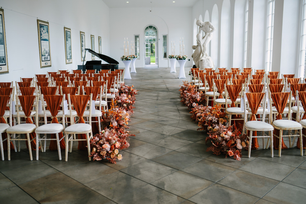 Elen Boutique burnt orange, autumn wedding decor. Margam Orangery Wedding 