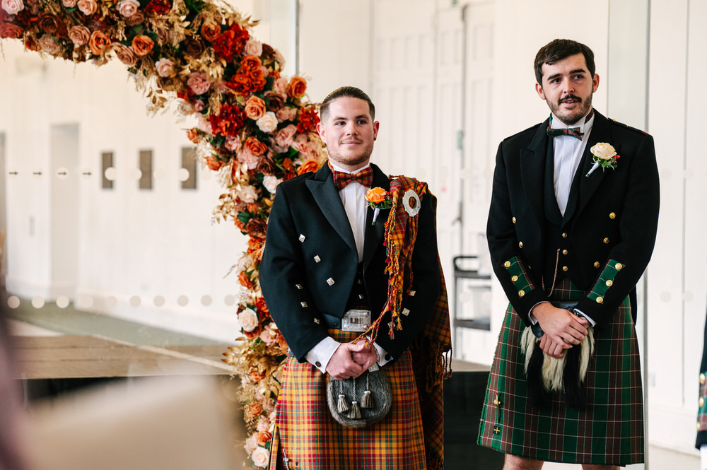 Groom in autumn coloured welsh tartan kilt