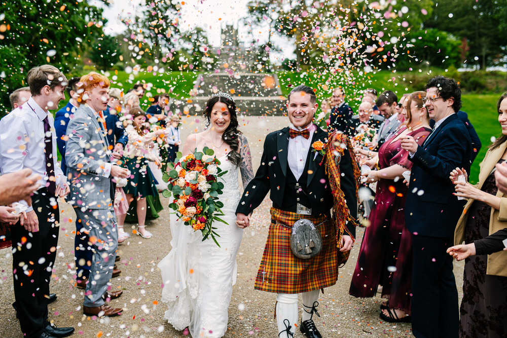 Confetti photos in front of Margam Castle - Wedding photography