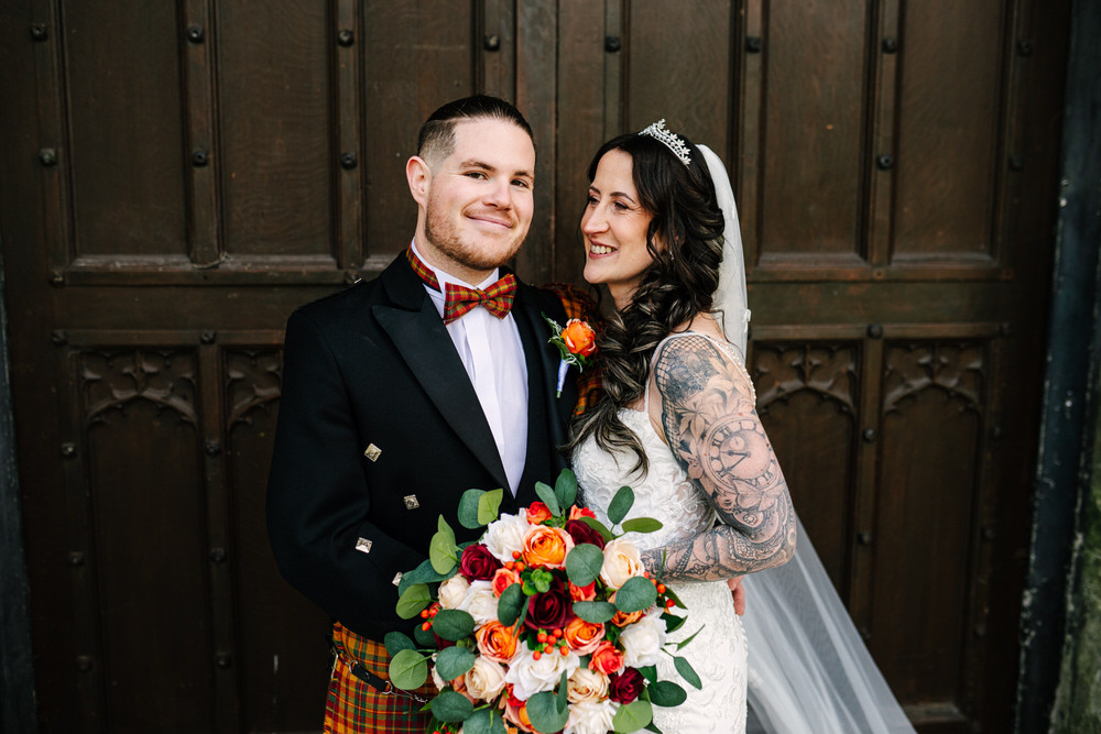Bride and Groom portraits outside Margam Castle - autumn coloured bouquet 